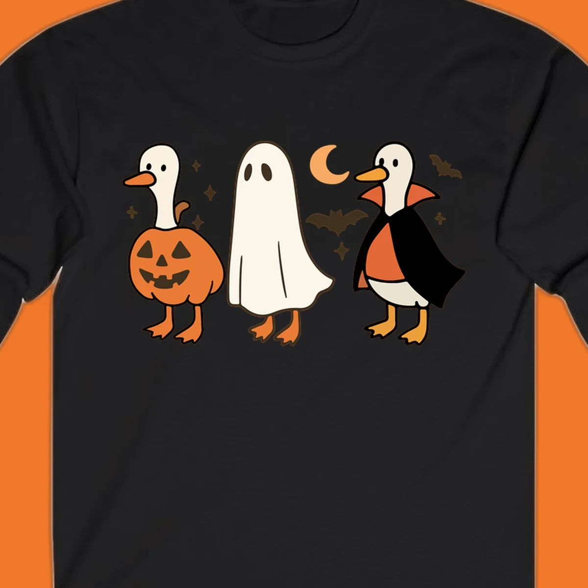 Halloween duck costumes: pumpkin, ghost, and vampire, with moon and bats. Halloween-duck-costumes.