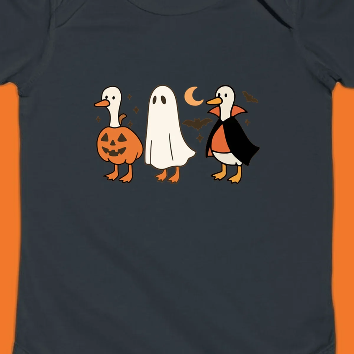 Halloween duck costumes: pumpkin, ghost, and vampire, with moon and bats. Halloween-duck-costumes.
