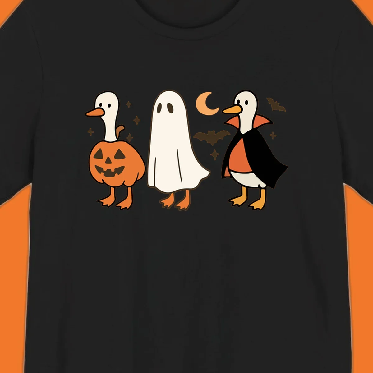 Halloween duck costumes: pumpkin, ghost, and vampire, with moon and bats. Halloween-duck-costumes.