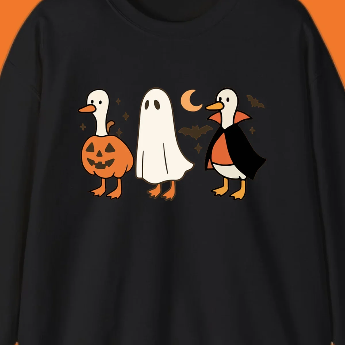 Halloween duck costumes: pumpkin, ghost, and vampire, with moon and bats. Halloween-duck-costumes.