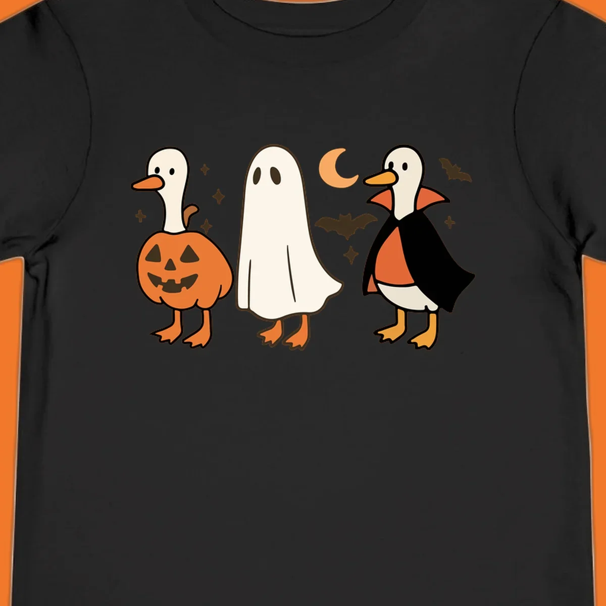 Halloween duck costumes: pumpkin, ghost, and vampire, with moon and bats. Halloween-duck-costumes.