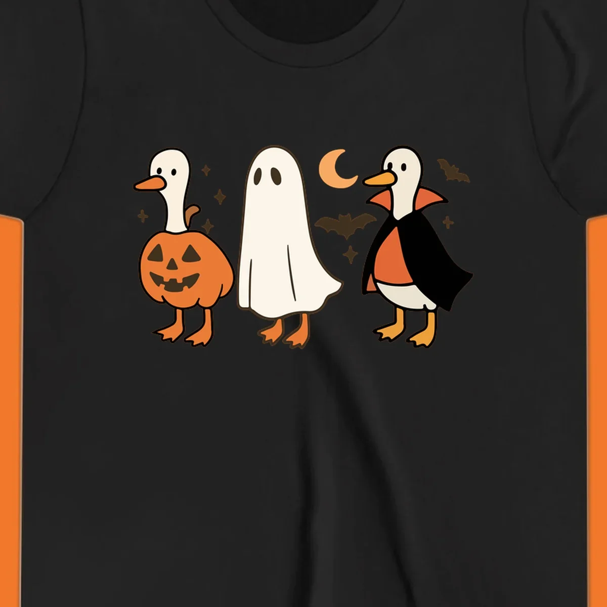 Halloween duck costumes: pumpkin, ghost, and vampire, with moon and bats. Halloween-duck-costumes.