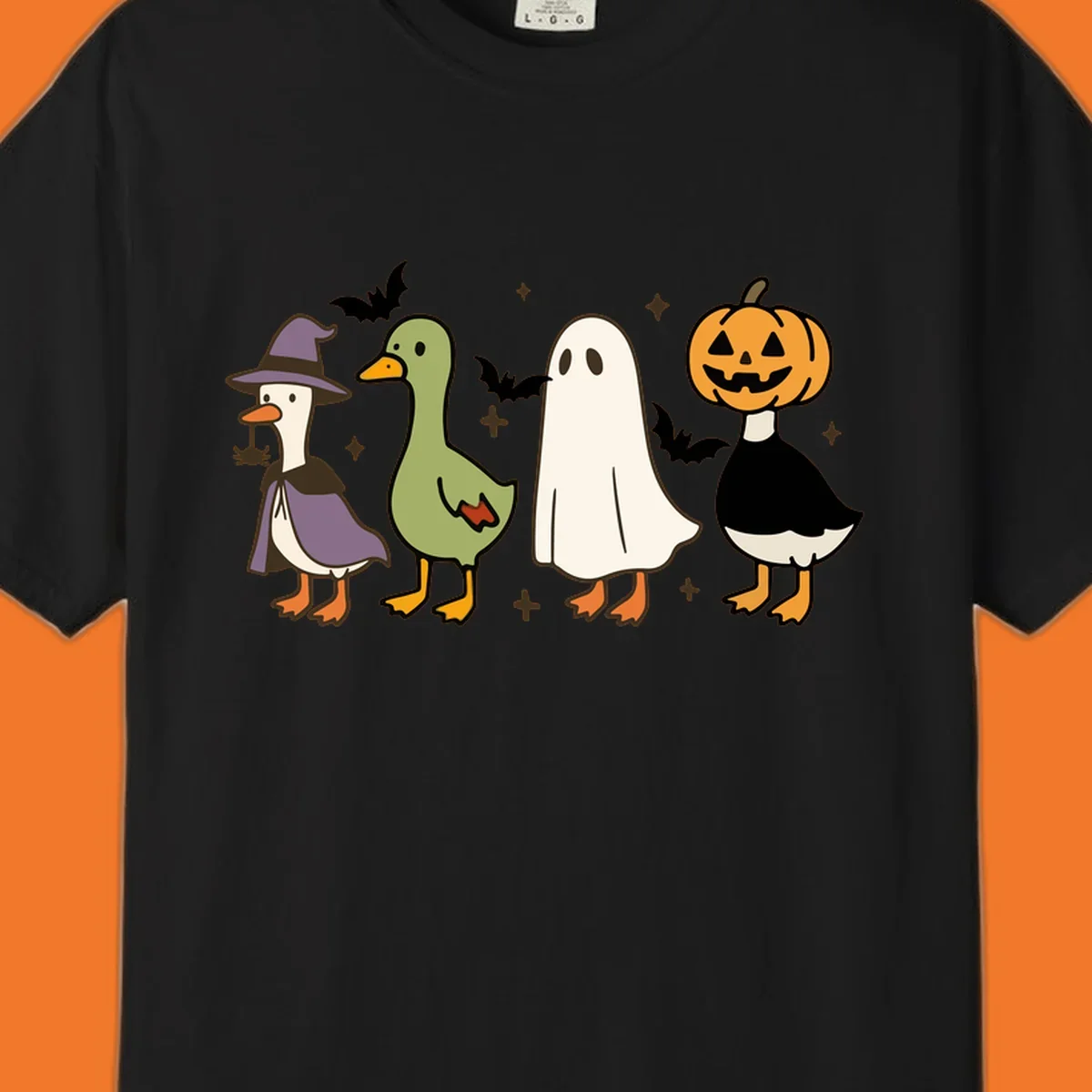 Illustration of four cute animals in Halloween costumes: a witch goose, a duckling, a ghost, and a pumpkin goose.