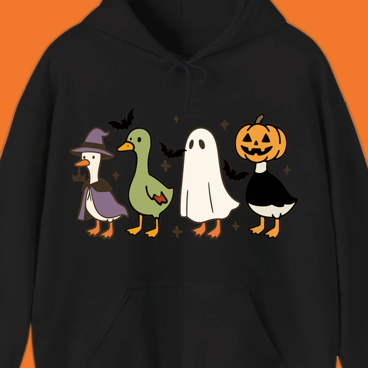 Illustration of four cute animals in Halloween costumes: a witch goose, a duckling, a ghost, and a pumpkin goose.