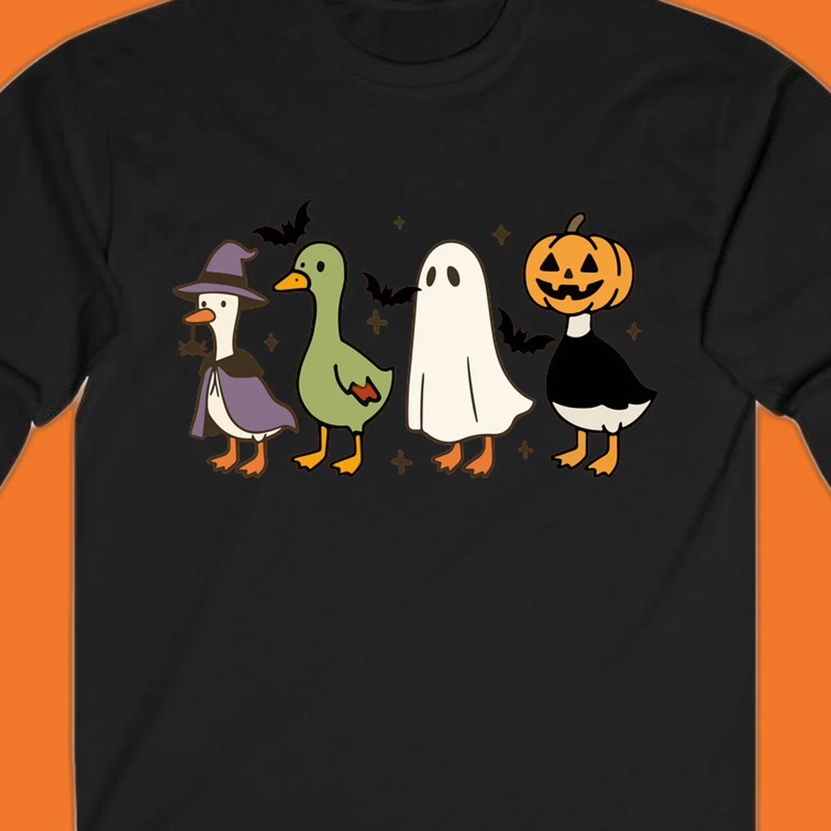 Illustration of four cute animals in Halloween costumes: a witch goose, a duckling, a ghost, and a pumpkin goose.