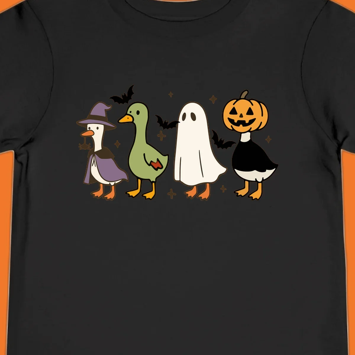 Illustration of four cute animals in Halloween costumes: a witch goose, a duckling, a ghost, and a pumpkin goose.