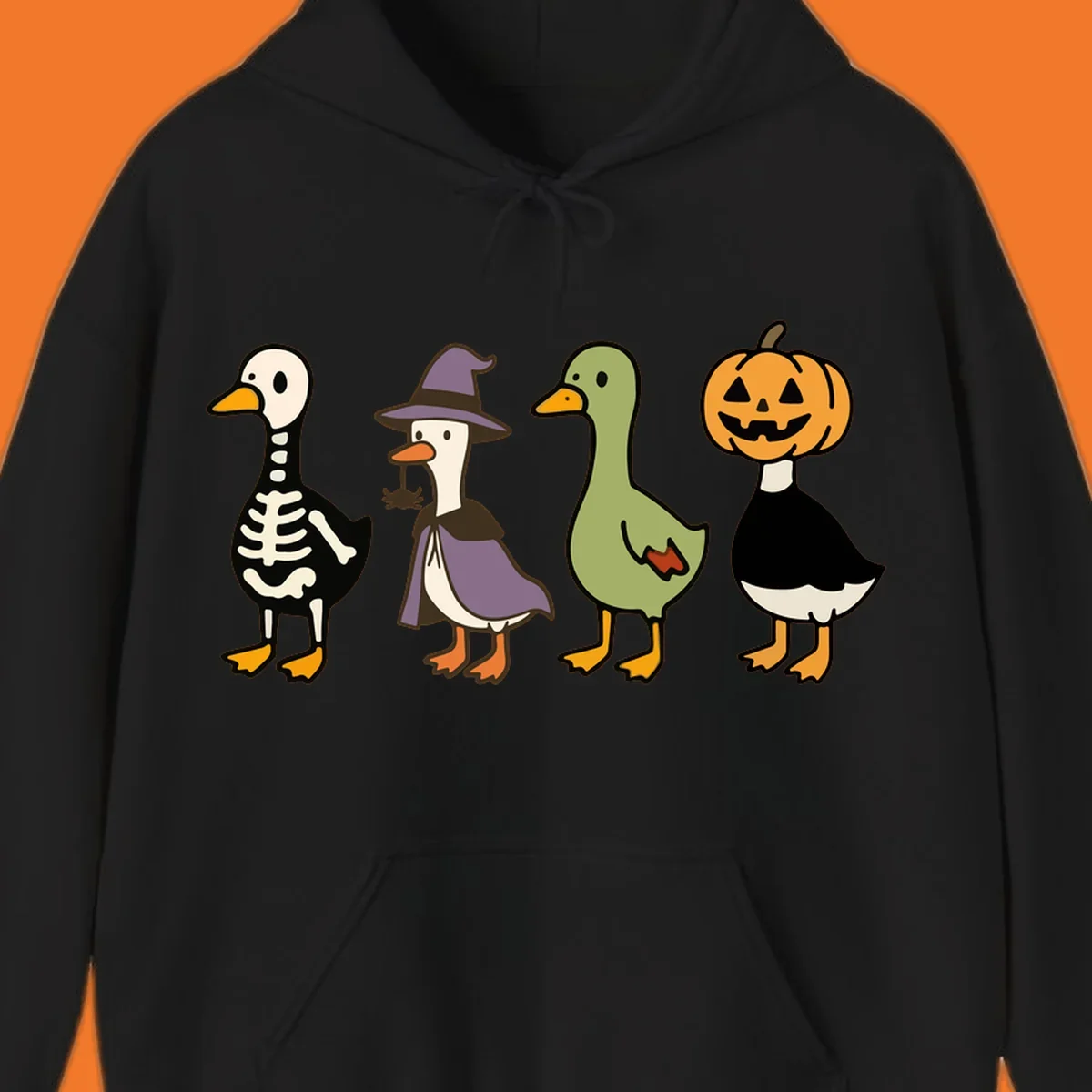 Four ducks in Halloween costumes: skeleton, witch, plain, and jack-o-lantern. Funny Halloween duck costumes.