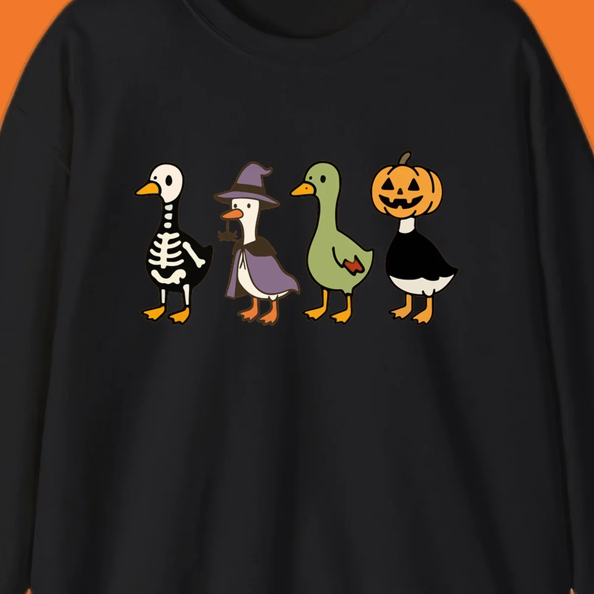 Four ducks in Halloween costumes: skeleton, witch, plain, and jack-o-lantern. Funny Halloween duck costumes.