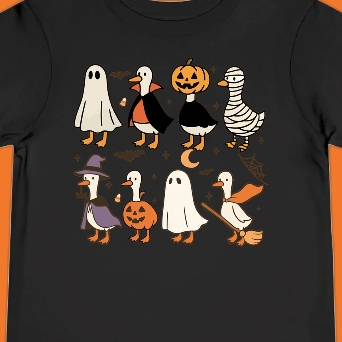 Illustration of cute ducks in various Halloween costumes like ghost, vampire, and pumpkin, on a dark background.