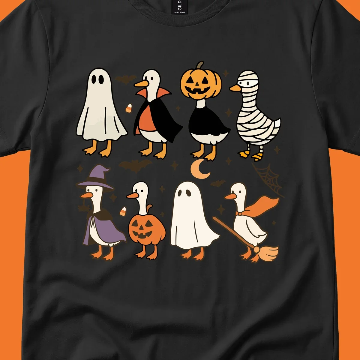 Illustration of cute ducks in various Halloween costumes like ghost, vampire, and pumpkin, on a dark background.