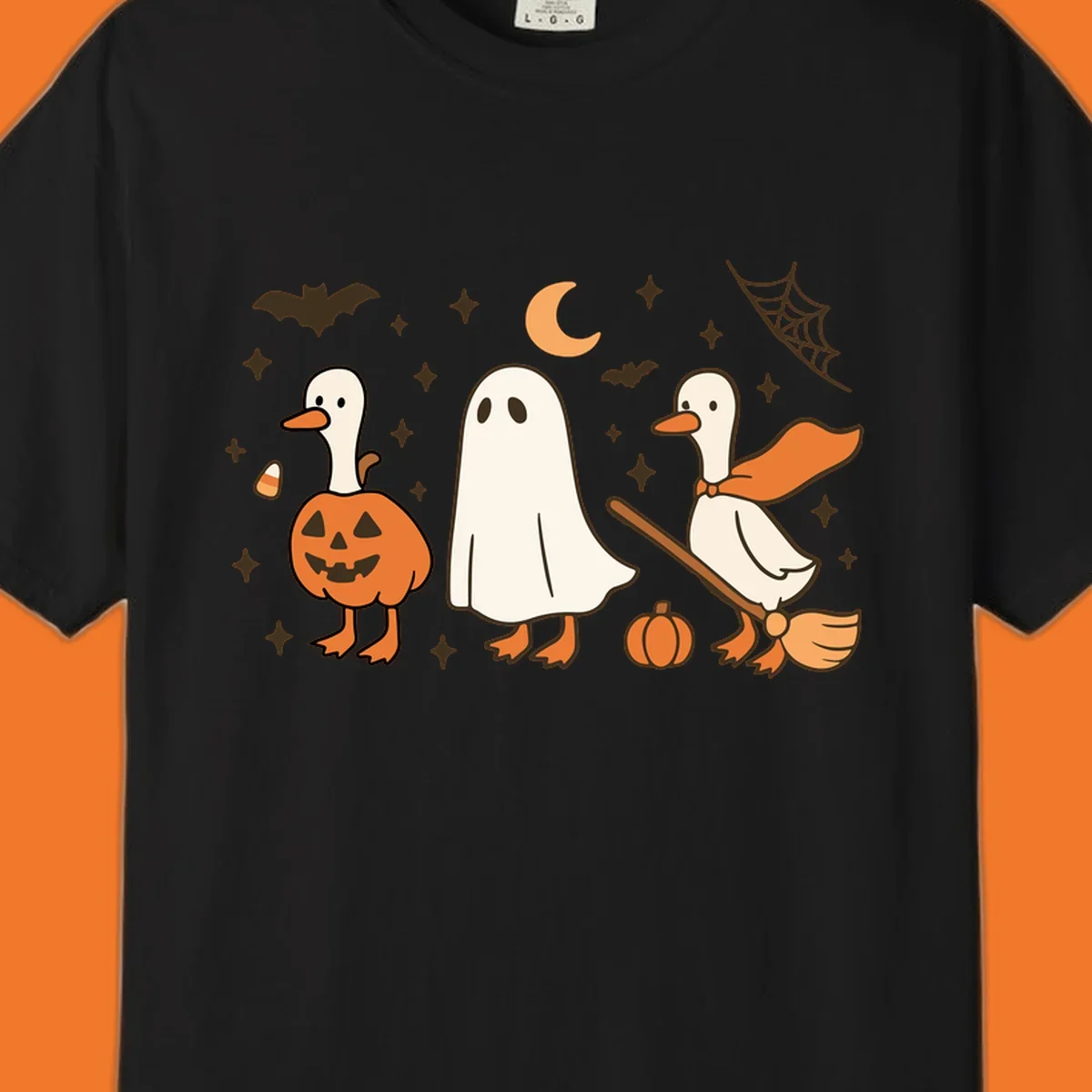 Cute geese in Halloween costumes: pumpkin, ghost, and witch on broom, with bats and stars.