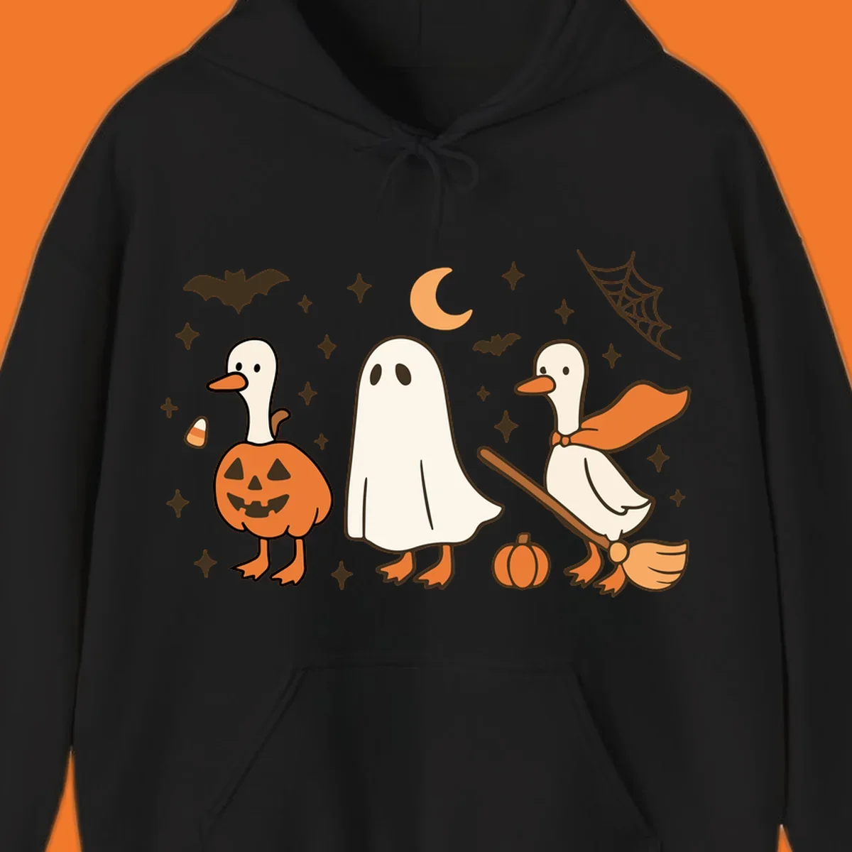 Cute geese in Halloween costumes: pumpkin, ghost, and witch on broom, with bats and stars.