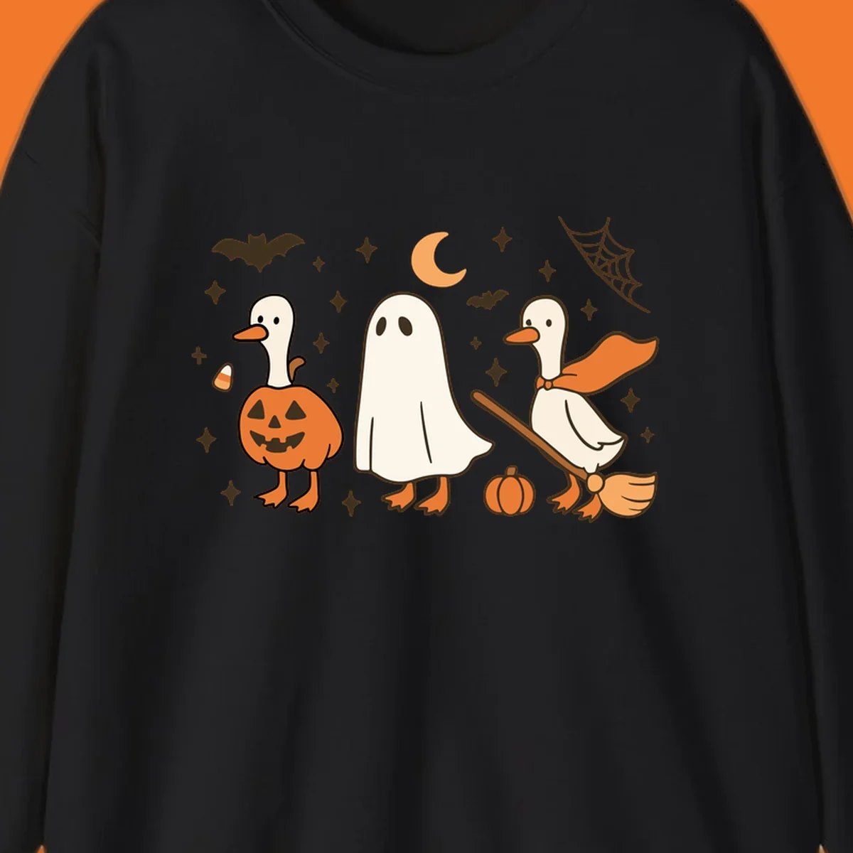 Cute geese in Halloween costumes: pumpkin, ghost, and witch on broom, with bats and stars.
