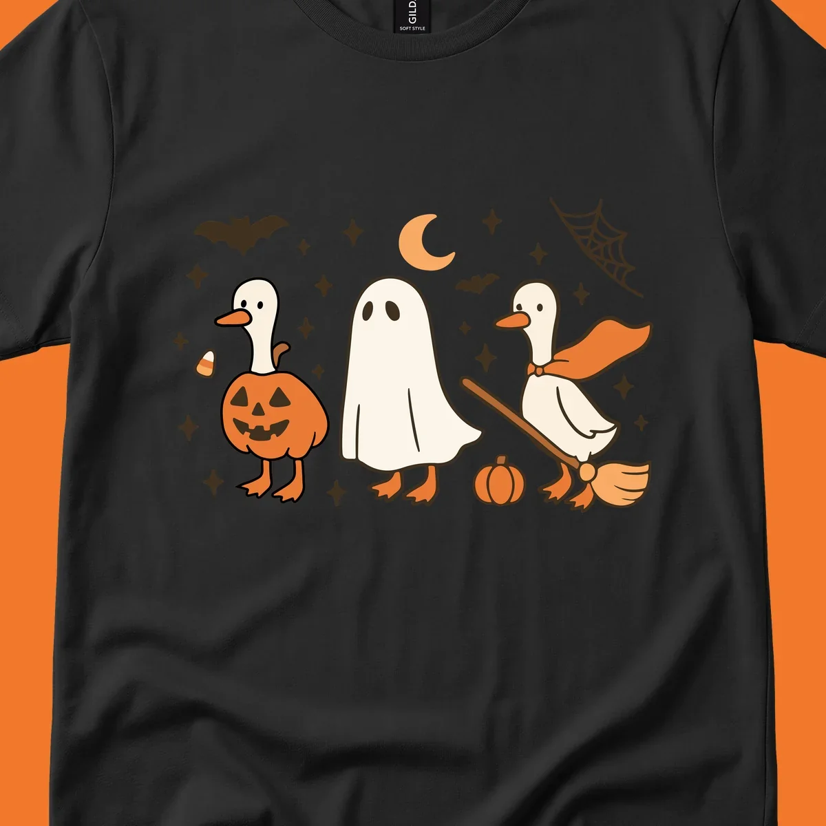 Cute geese in Halloween costumes: pumpkin, ghost, and witch on broom, with bats and stars.