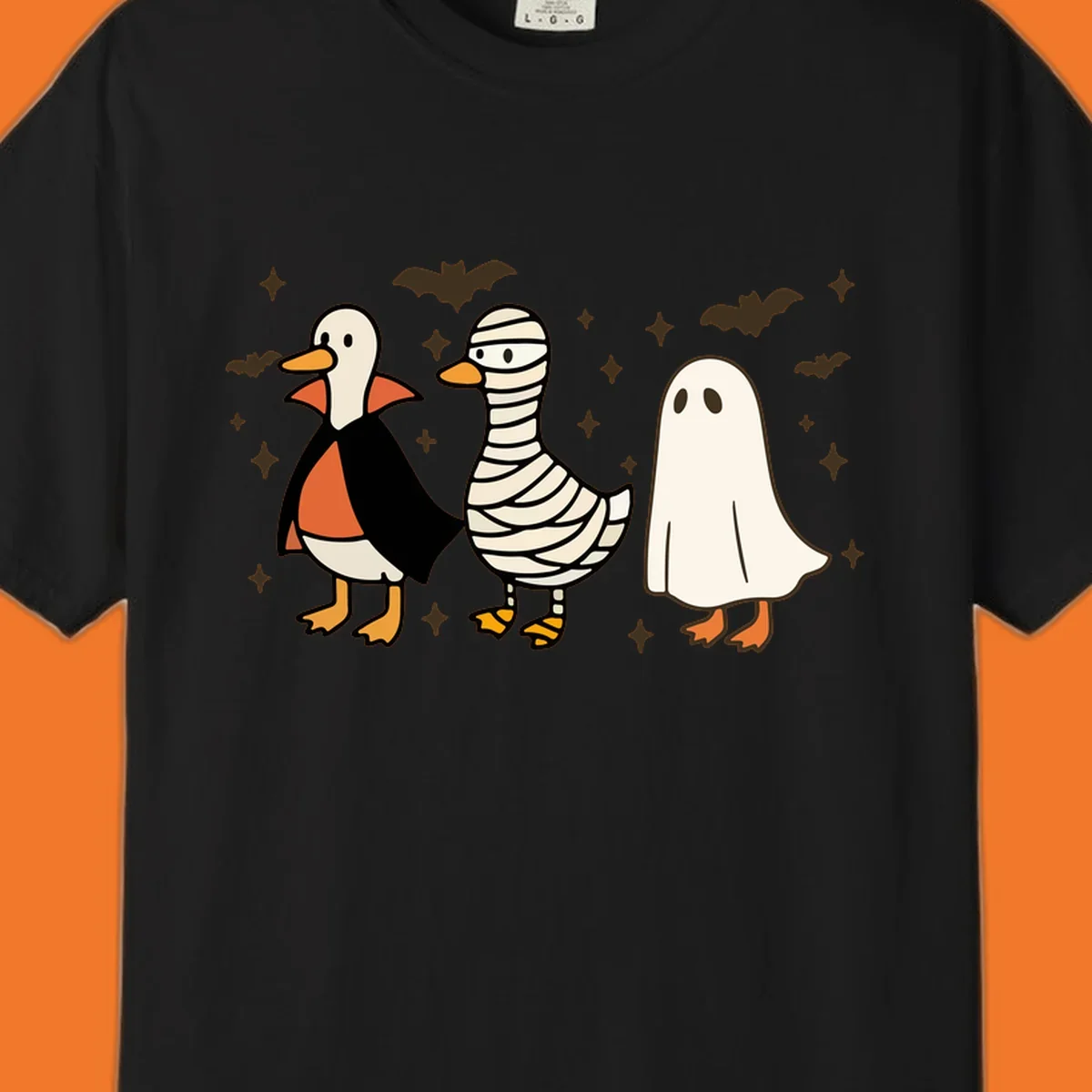 Halloween duck trio in costumes: vampire, mummy, and ghost. holiday-duck-trio.