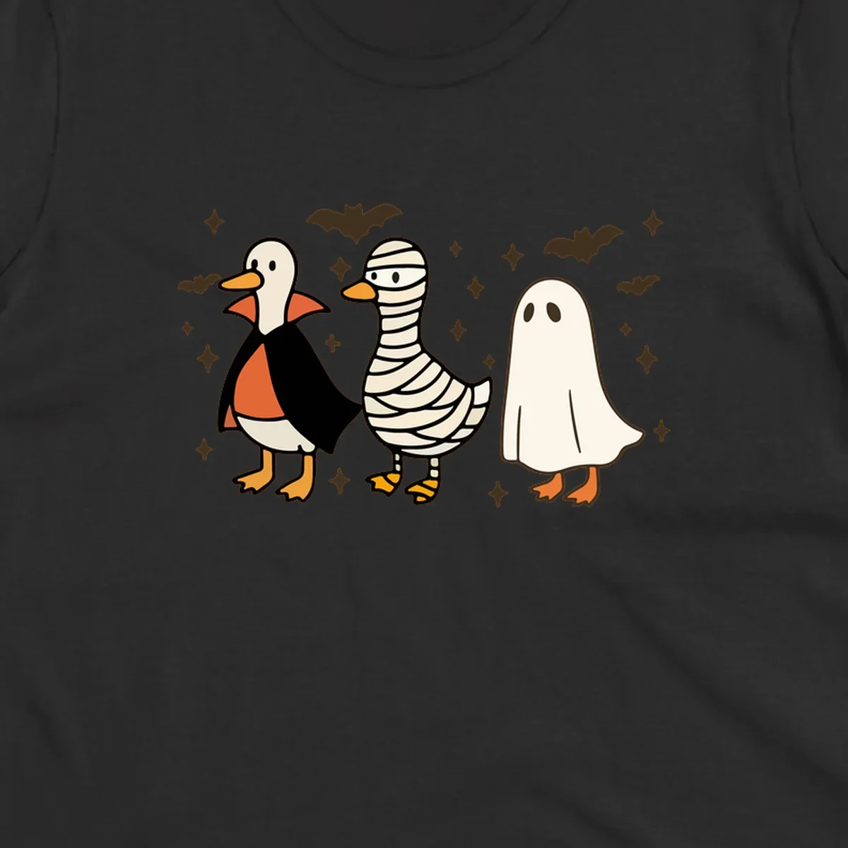 Halloween duck trio in costumes: vampire, mummy, and ghost. holiday-duck-trio.