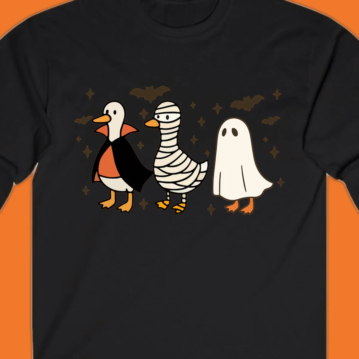Halloween duck trio in costumes: vampire, mummy, and ghost. holiday-duck-trio.