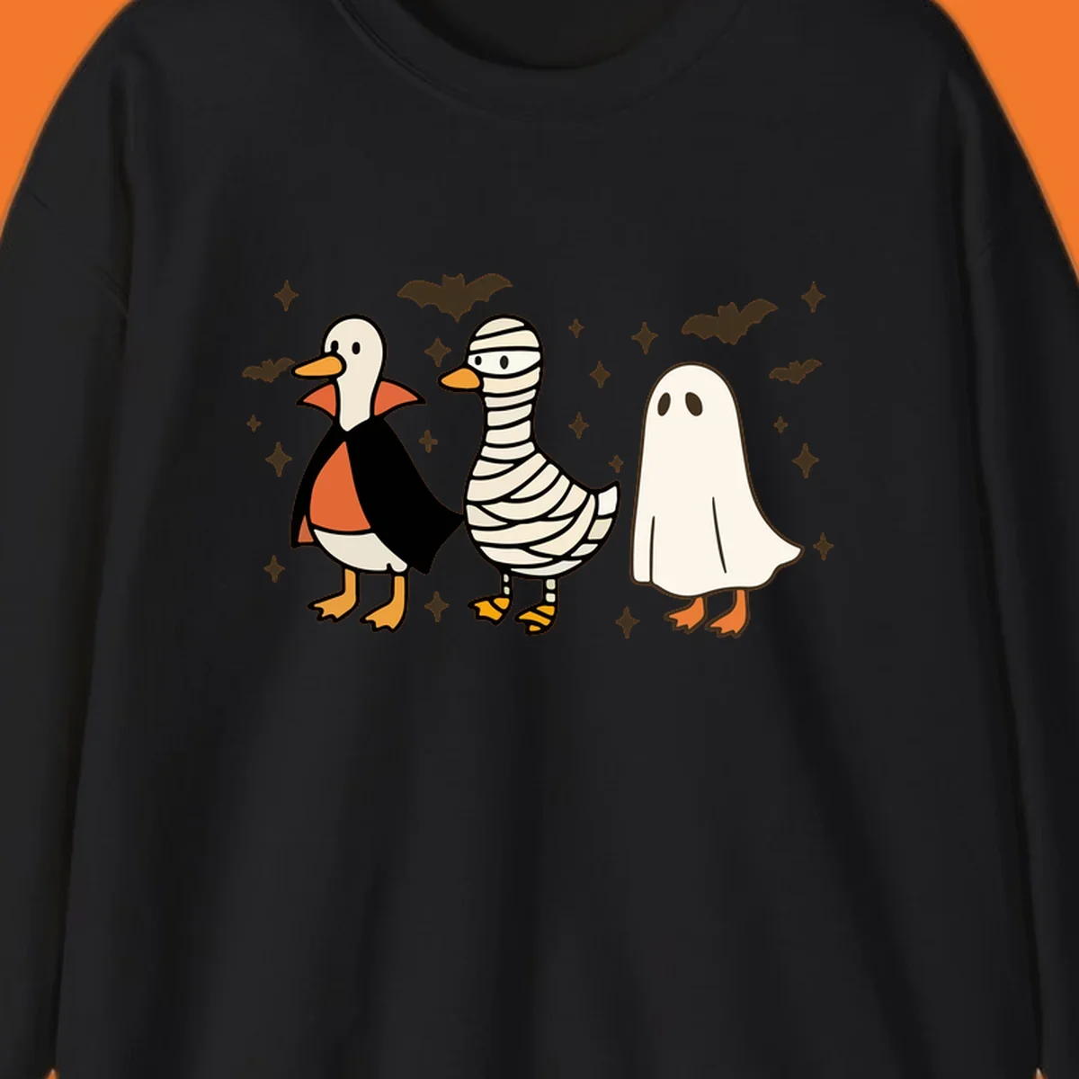 Halloween duck trio in costumes: vampire, mummy, and ghost. holiday-duck-trio.