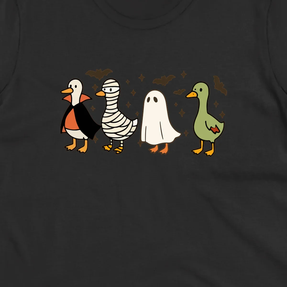 Four cute ducks in Halloween costumes: vampire, mummy, ghost, and plain duck, with bats and stars.