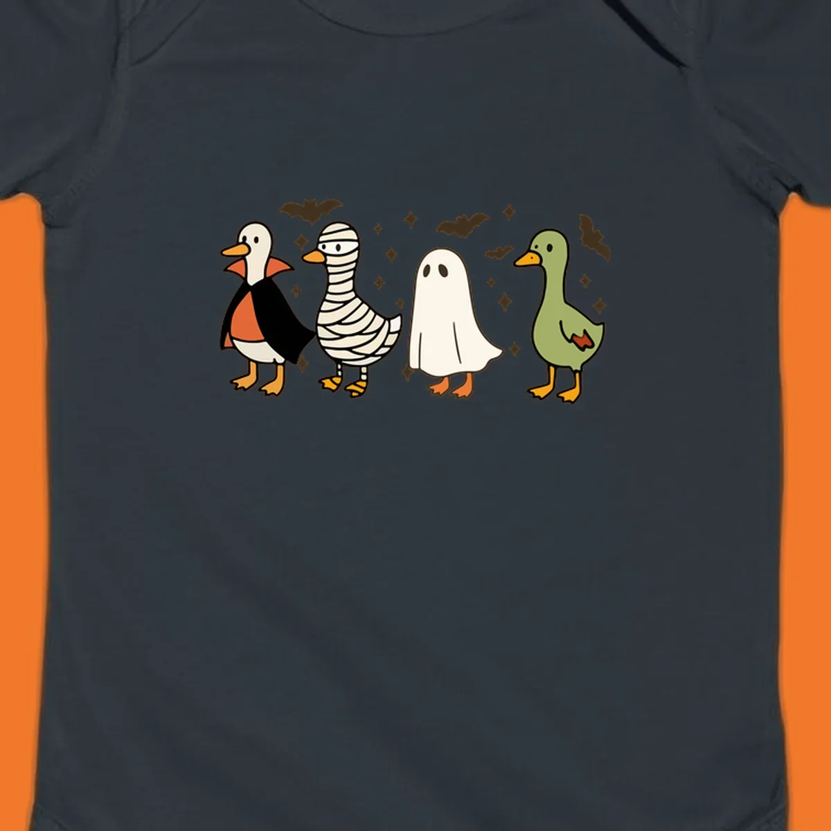 Four cute ducks in Halloween costumes: vampire, mummy, ghost, and plain duck, with bats and stars.