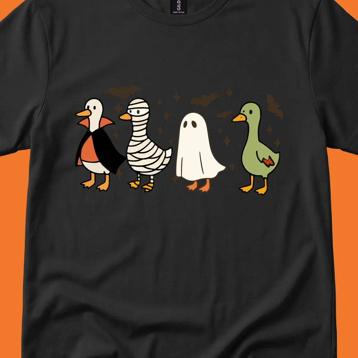 Four cute ducks in Halloween costumes: vampire, mummy, ghost, and plain duck, with bats and stars.