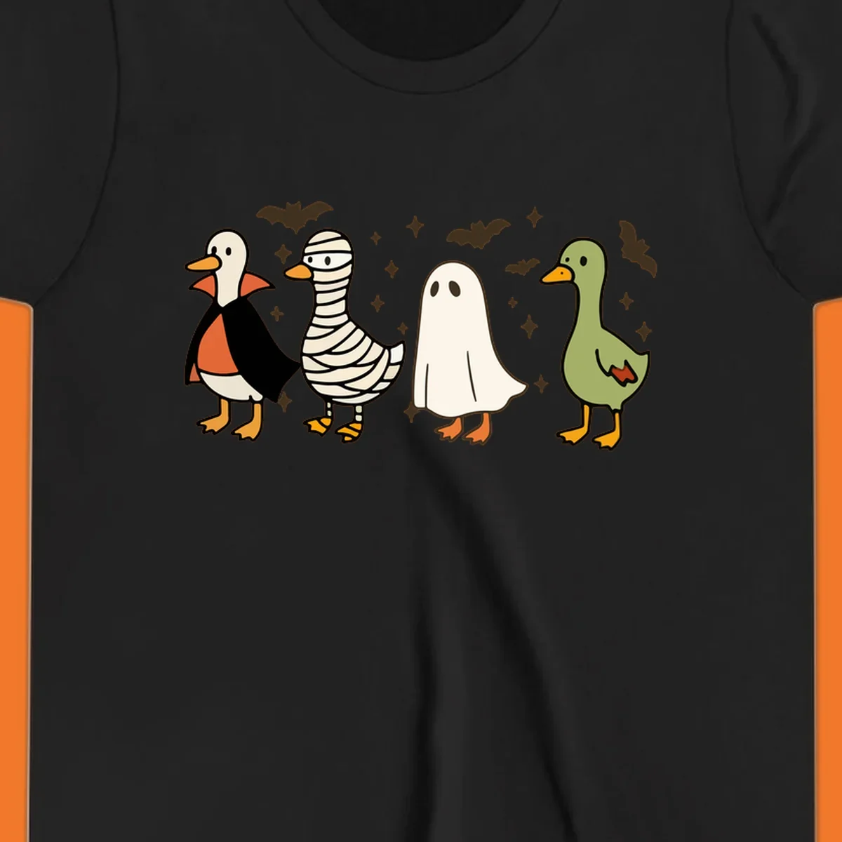 Four cute ducks in Halloween costumes: vampire, mummy, ghost, and plain duck, with bats and stars.