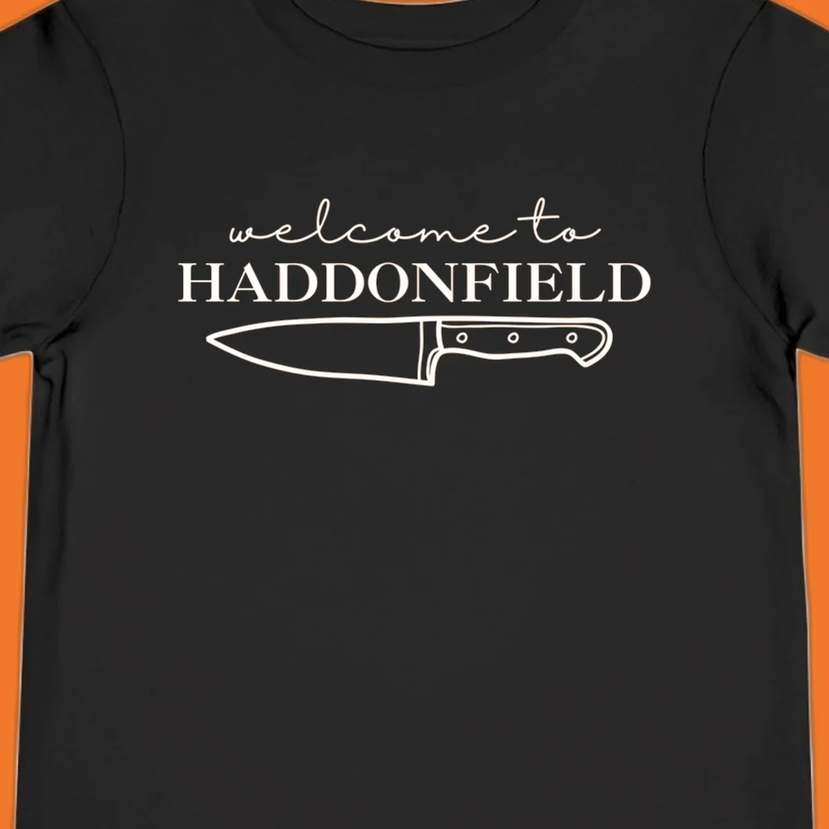 Welcome to Haddonfield text with a knife illustration, Halloween horror movie theme.