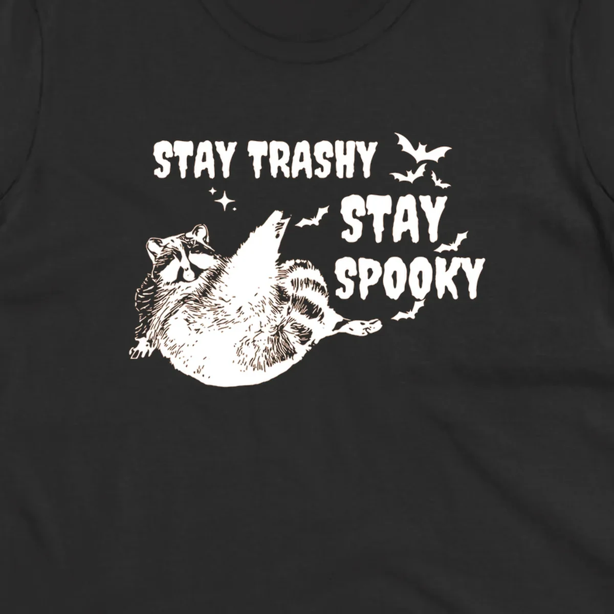 Trashy spooky raccoon illustration with bats and text for Halloween.