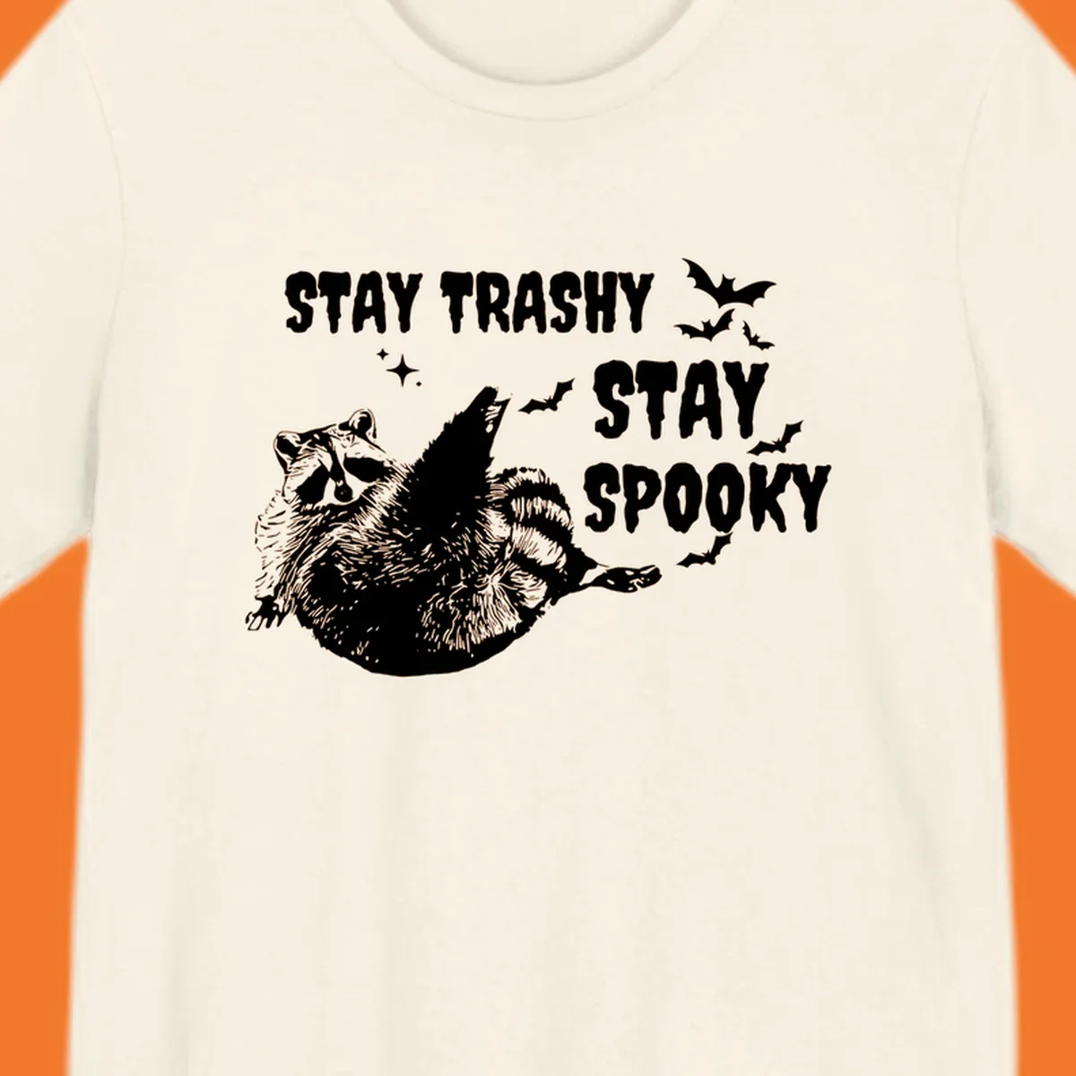 Trashy spooky raccoon illustration with bats and text for Halloween.