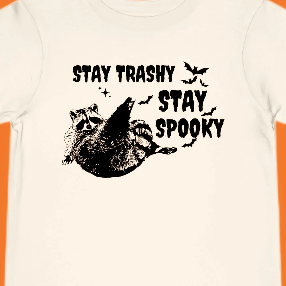 Trashy spooky raccoon illustration with bats and text for Halloween.