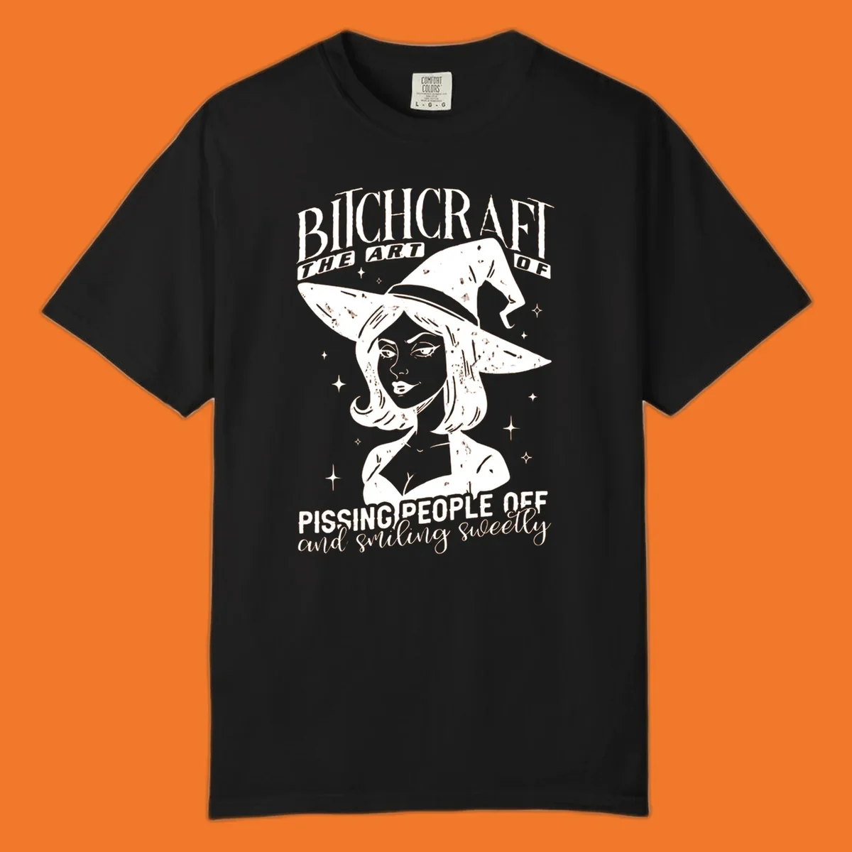 Illustration of a witch with the text Bitchcraft The Art Of Pissing People Off and smiling sweetly.