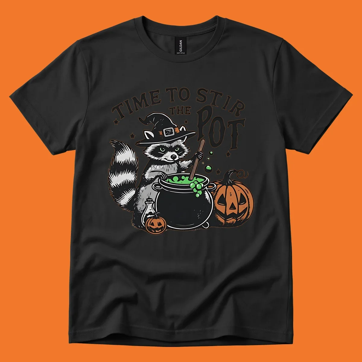 Raccoon witch stirring a halloween pot, text says TIME TO STIR THE POT.