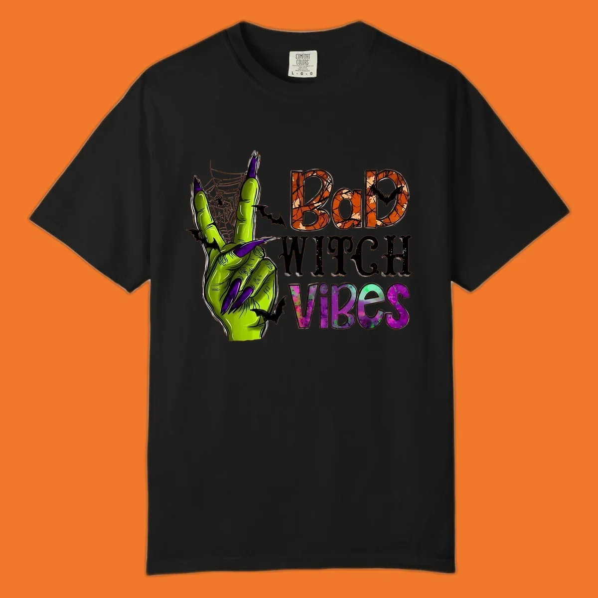 Bad Witch Vibes Halloween graphic with a green witch hand peace sign and bats.