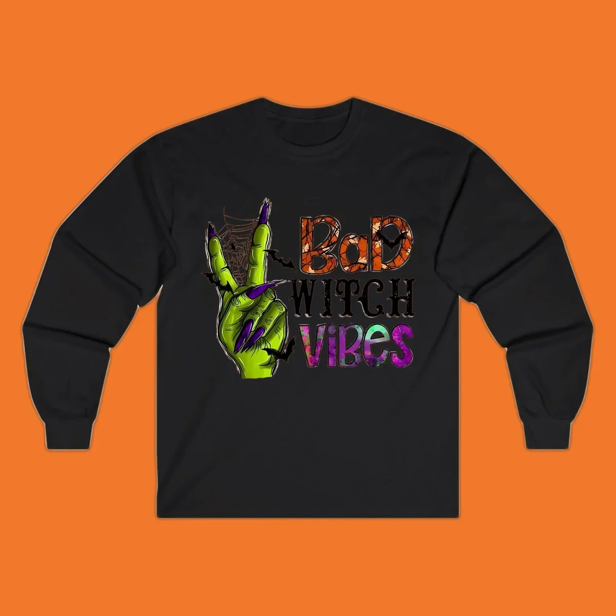 Bad Witch Vibes Halloween graphic with a green witch hand peace sign and bats.