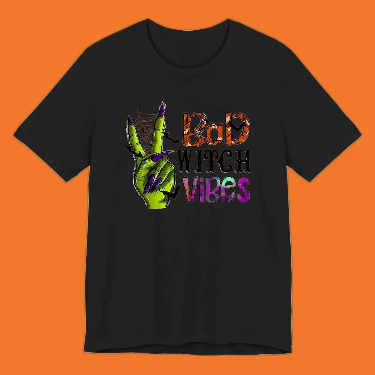 Bad Witch Vibes Halloween graphic with a green witch hand peace sign and bats.