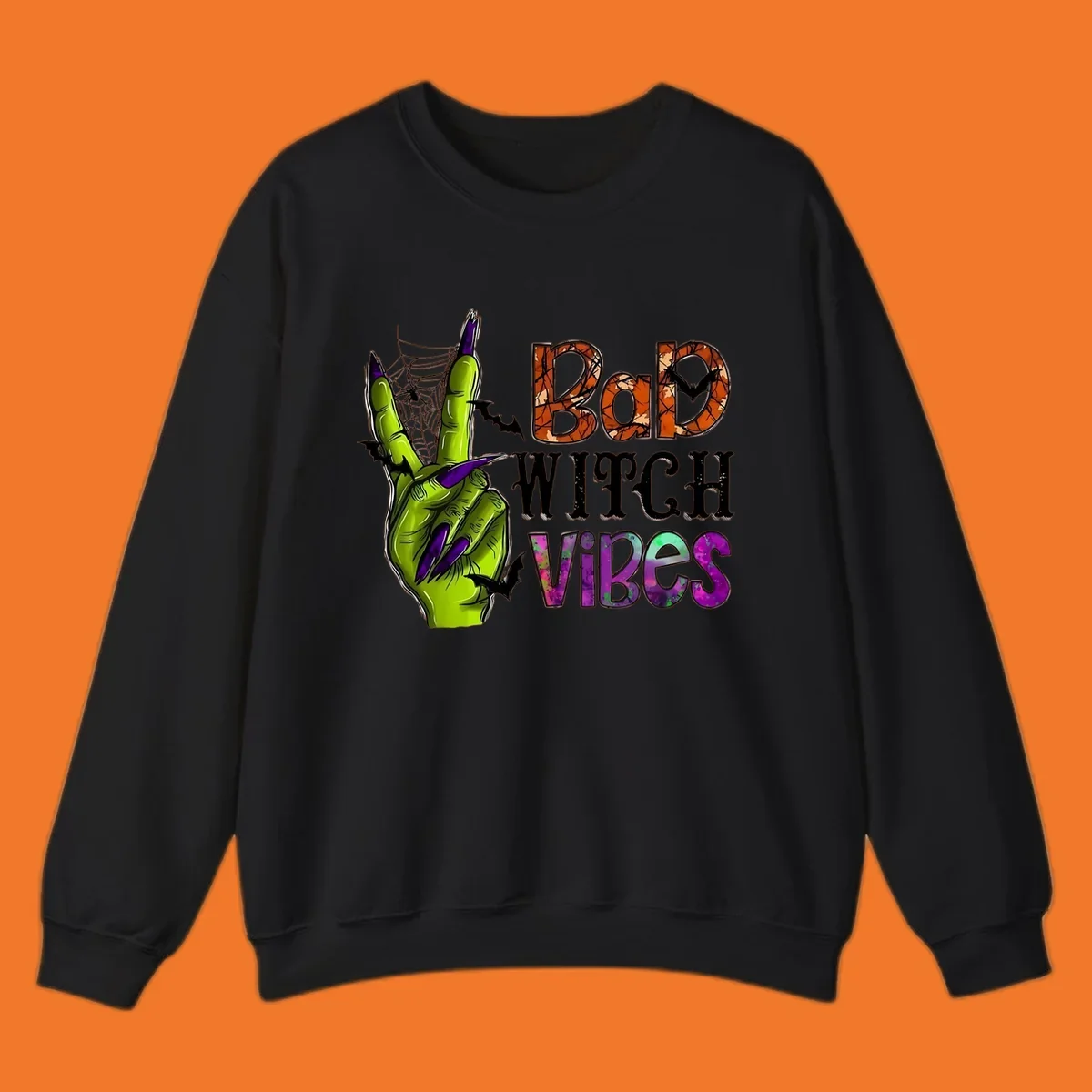 Bad Witch Vibes Halloween graphic with a green witch hand peace sign and bats.
