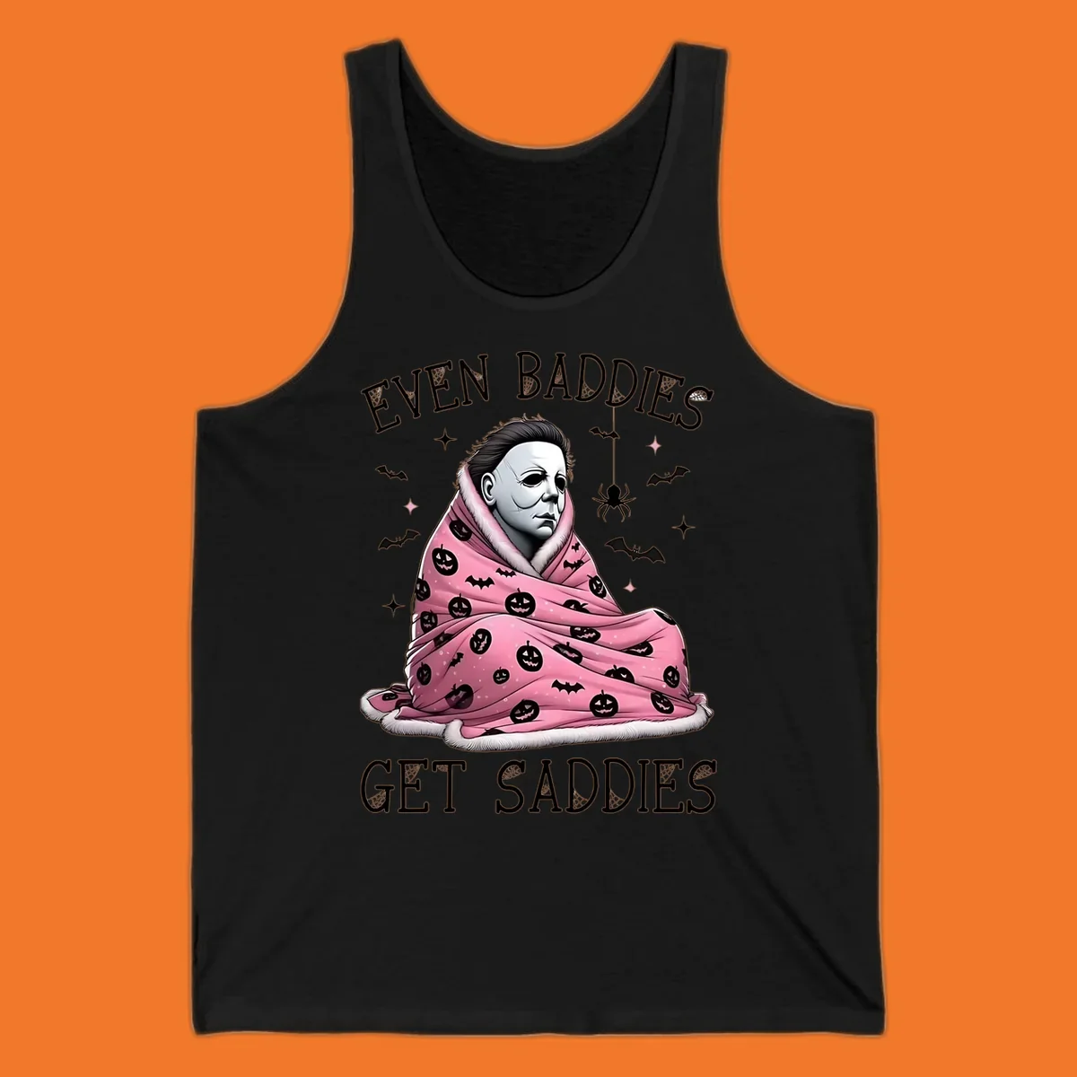Michael Myers in a pink pumpkin blanket with text 'EVEN BADDIES GET SADDIES', for the michael-myers-cozy concept.