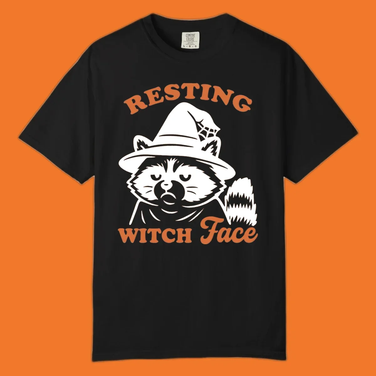 Resting Witch Face raccoon Halloween design with text.