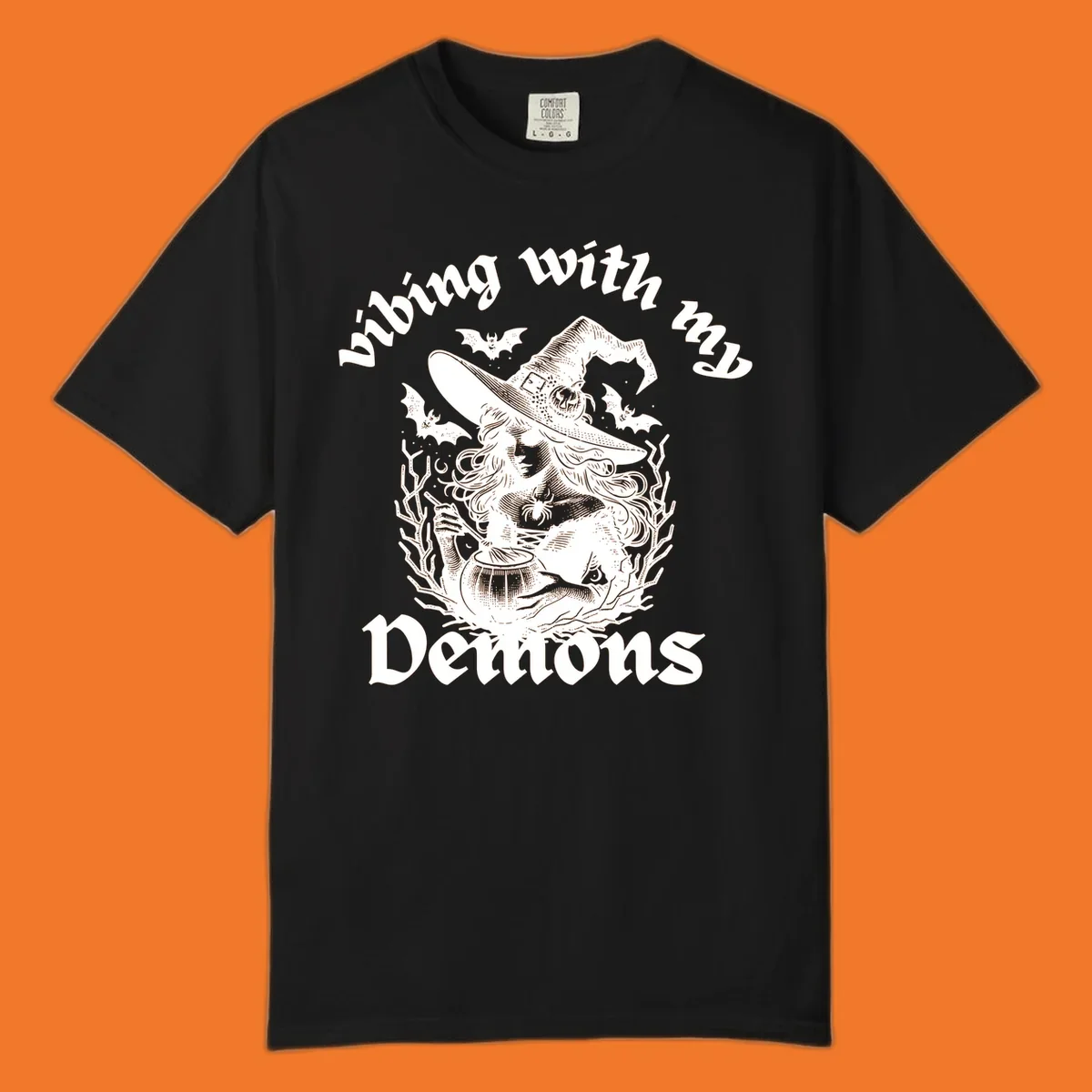 Witch stirring cauldron with bats and text 'vibing with my Demons', witch-vibing-demons design