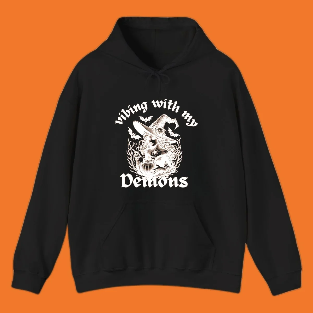 Witch stirring cauldron with bats and text 'vibing with my Demons', witch-vibing-demons design