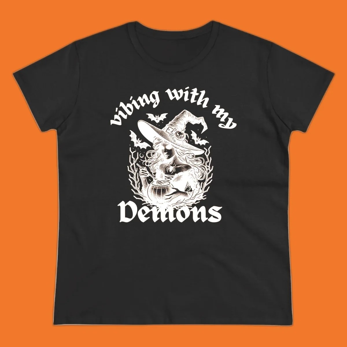 Witch stirring cauldron with bats and text 'vibing with my Demons', witch-vibing-demons design