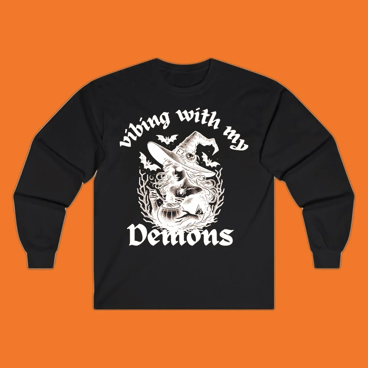 Witch stirring cauldron with bats and text 'vibing with my Demons', witch-vibing-demons design