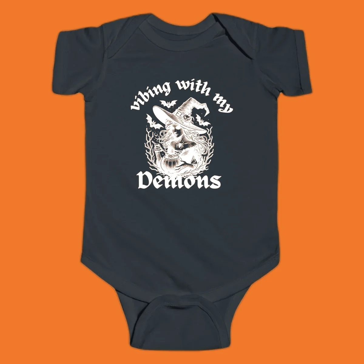 Witch stirring cauldron with bats and text 'vibing with my Demons', witch-vibing-demons design