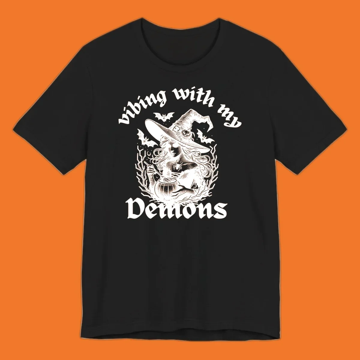 Witch stirring cauldron with bats and text 'vibing with my Demons', witch-vibing-demons design