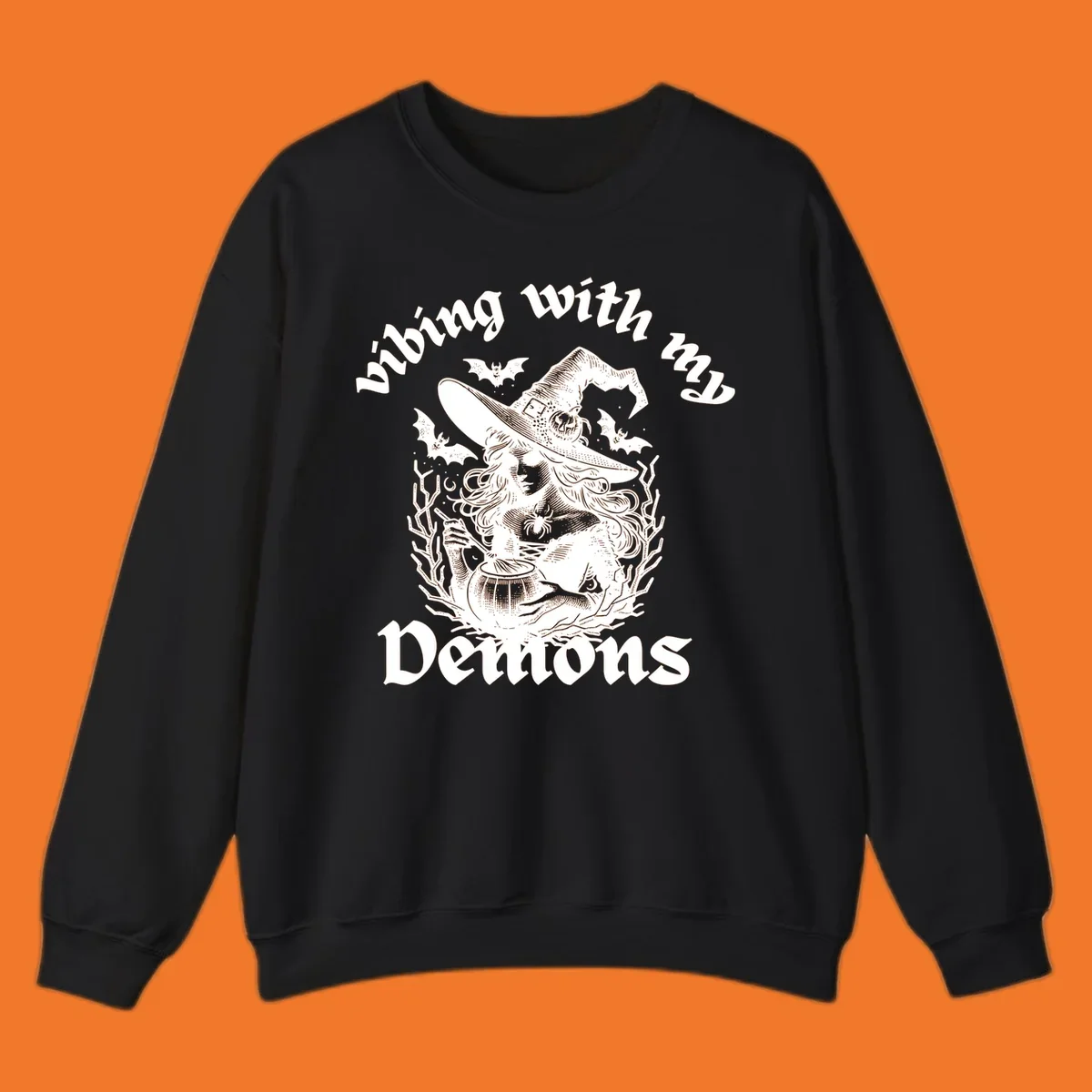 Witch stirring cauldron with bats and text 'vibing with my Demons', witch-vibing-demons design