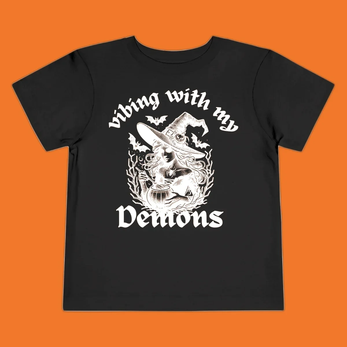 Witch stirring cauldron with bats and text 'vibing with my Demons', witch-vibing-demons design