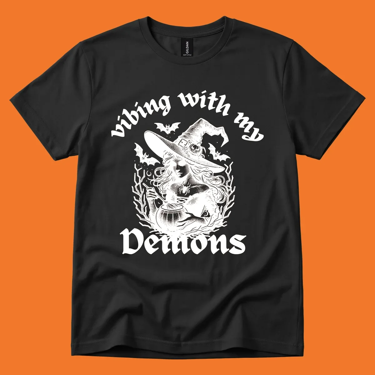 Witch stirring cauldron with bats and text 'vibing with my Demons', witch-vibing-demons design