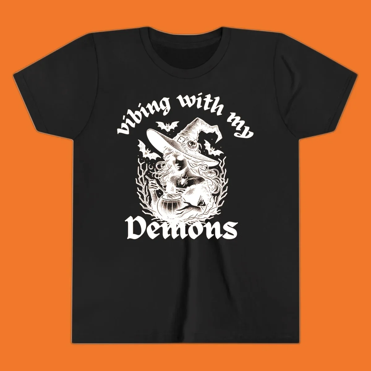 Witch stirring cauldron with bats and text 'vibing with my Demons', witch-vibing-demons design