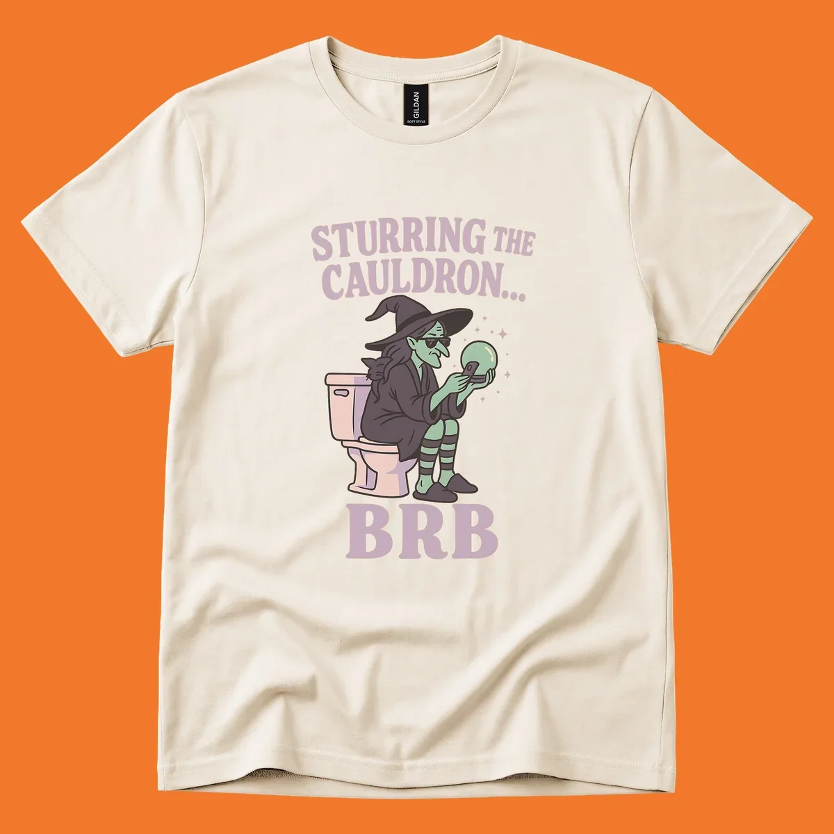 Funny witch on toilet looking at phone with crystal ball, text says Stirring the Cauldron... BRB