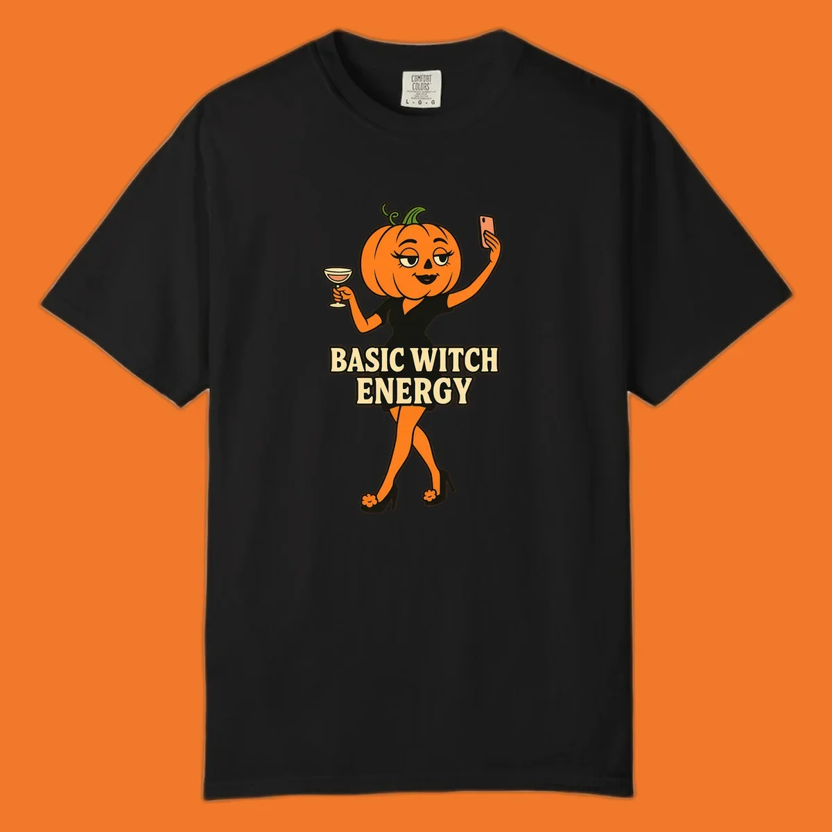 Pumpkin character with 'BASIC WITCH ENERGY' text, holding a cocktail and phone for a selfie.